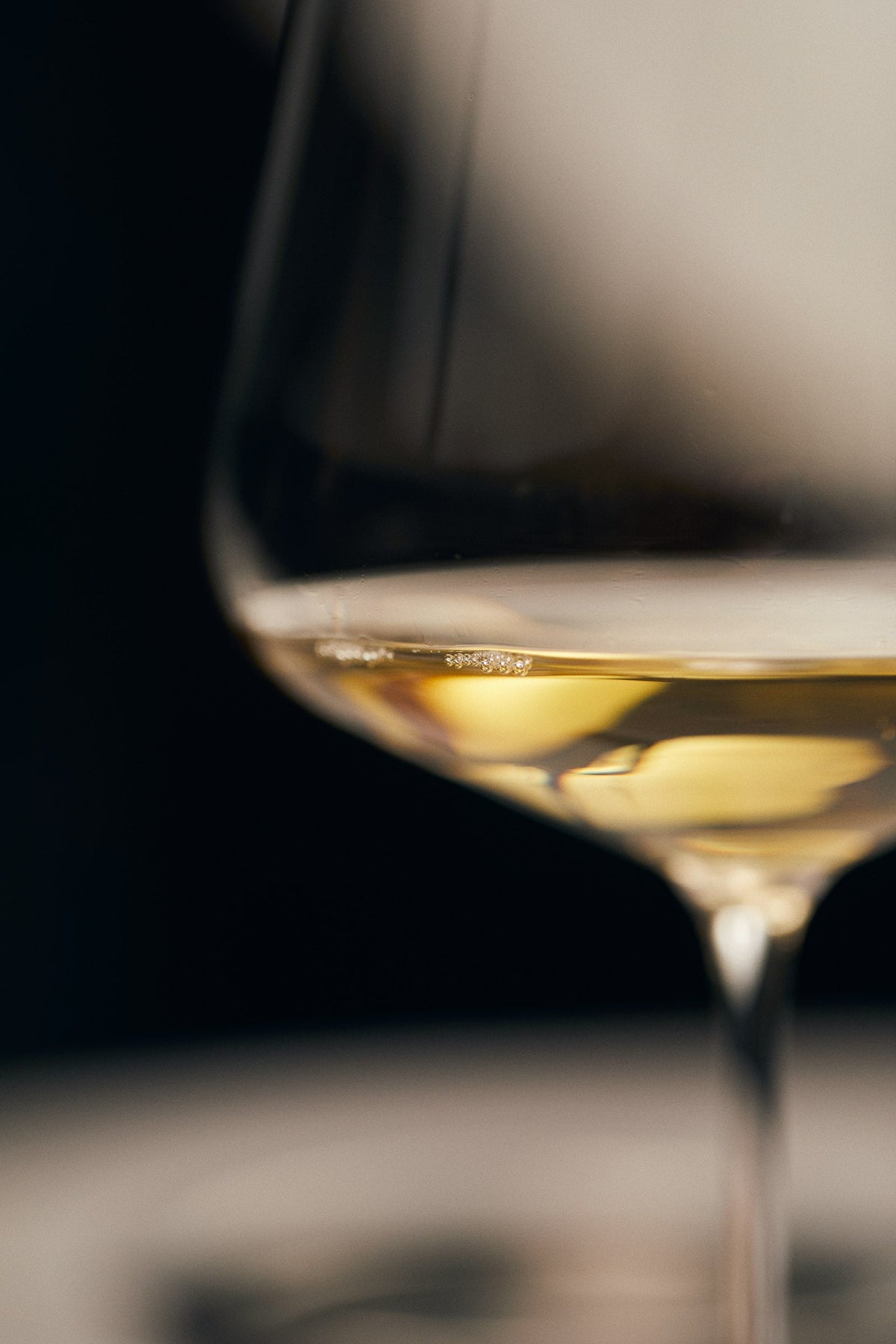 A glass of white wine in soft light