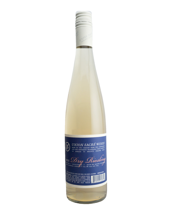 A bottle of 2021 Union Sacré Dry Riesling wine with a white label and blue text, indicating the brand and variety.