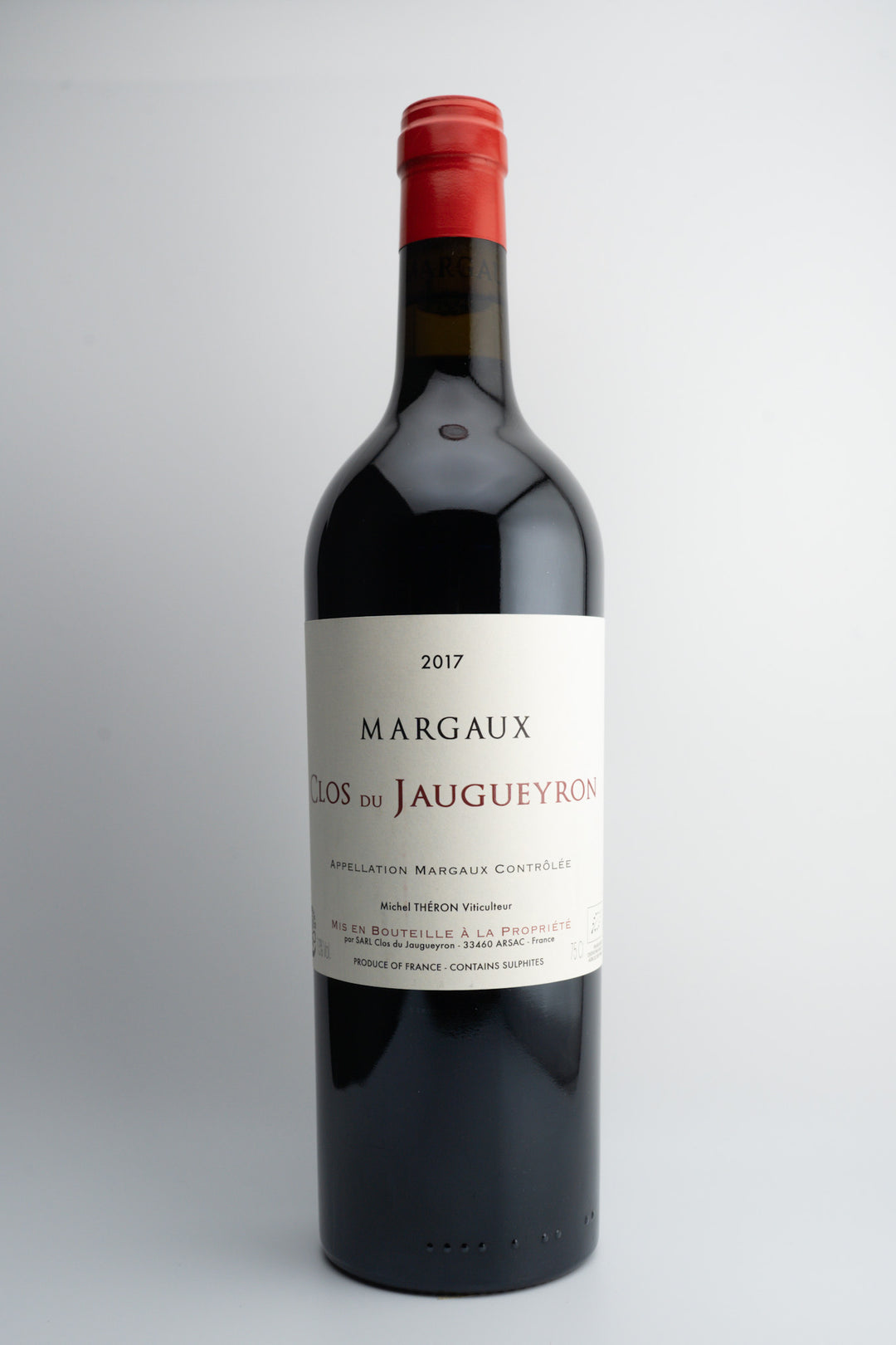 A bottle of 2017 Clos du Jaugueyron Margaux wine with a red cap and label, indicating it is a red wine from Bordeaux, France.