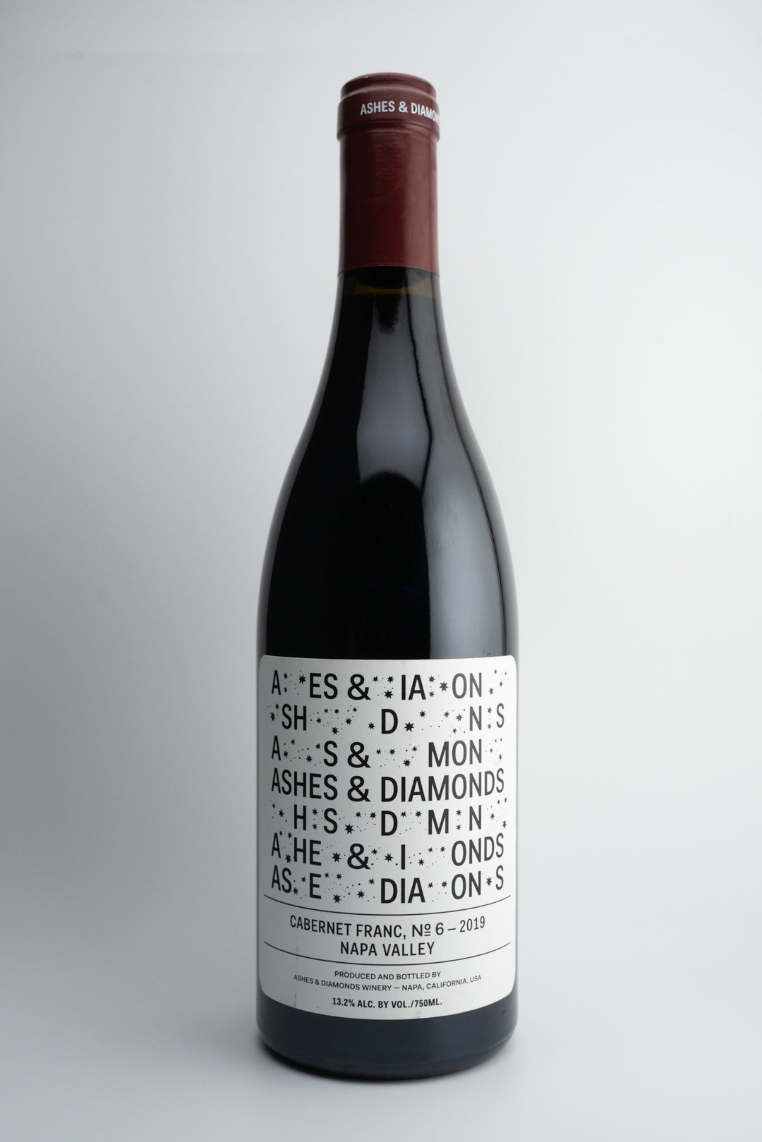 A bottle of 2019 Ashes & Diamonds Cabernet Franc wine with a label that includes the wine variety and 'Napa Valley, California'.