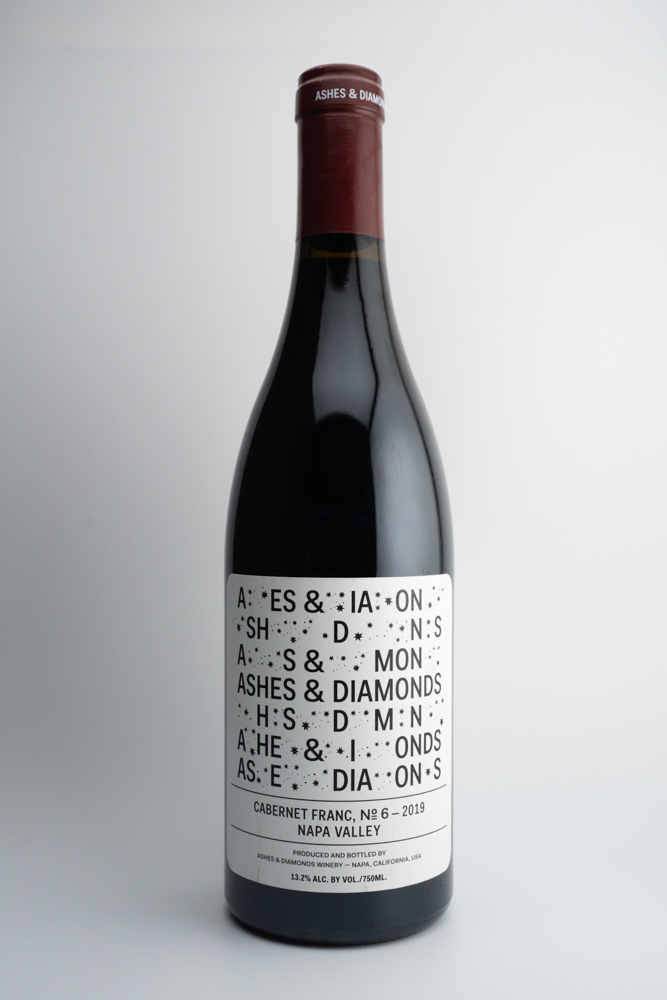 A bottle of 2019 Ashes & Diamonds Cabernet Franc wine with a label that includes the wine variety and 'Napa Valley, California'.