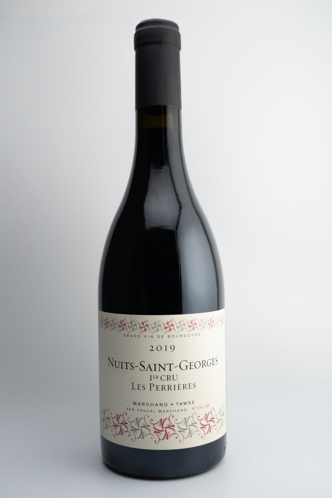 A bottle of 2019 Marchand Tawse Nuit St. Georges 1er Cru 'Les Perrieres' wine from Burgundy, France.