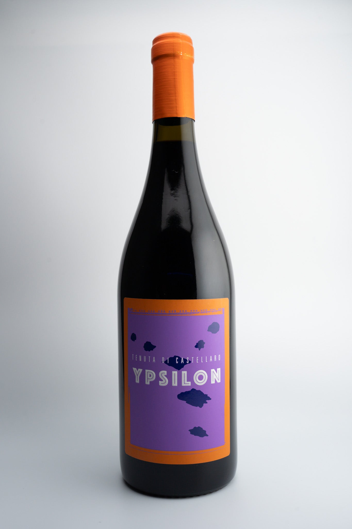 A bottle of 2020 Tenuta Castellaro 'Ypsilon' wine with an orange cap and a purple label, indicating it is a red wine from Terre Siciliane IGT, Sicily.