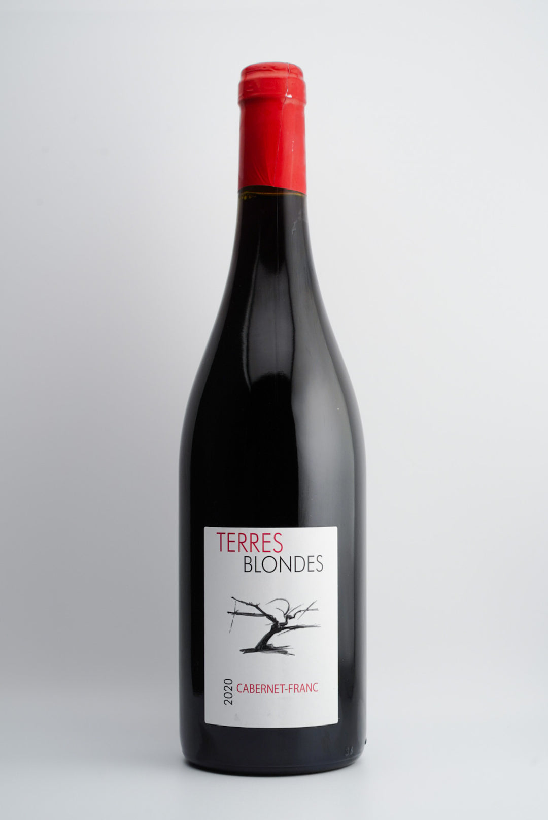 A bottle of 2020 Terres Blondes Cabernet Franc wine with a red cap and a label featuring the name of the wine and the varietal.
