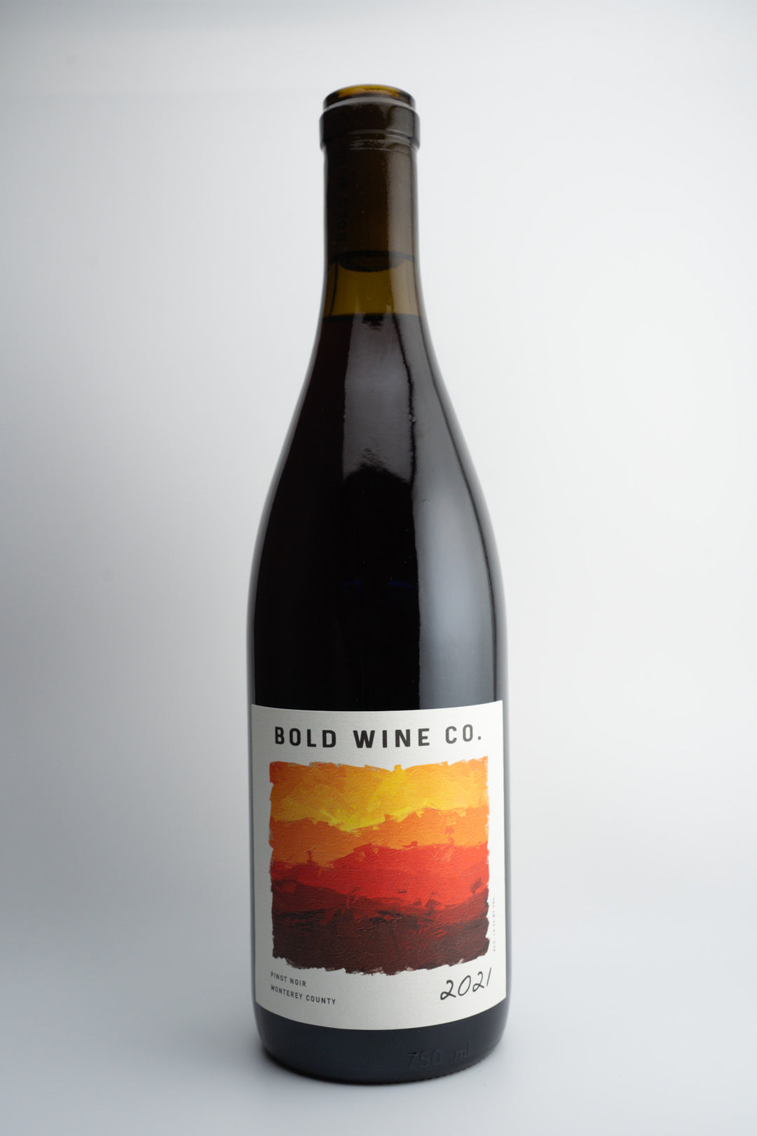 A bottle of 2021 Bold Wine Co. Pinot Noir with a label showing a warm sunset-like color and the text '2021'.