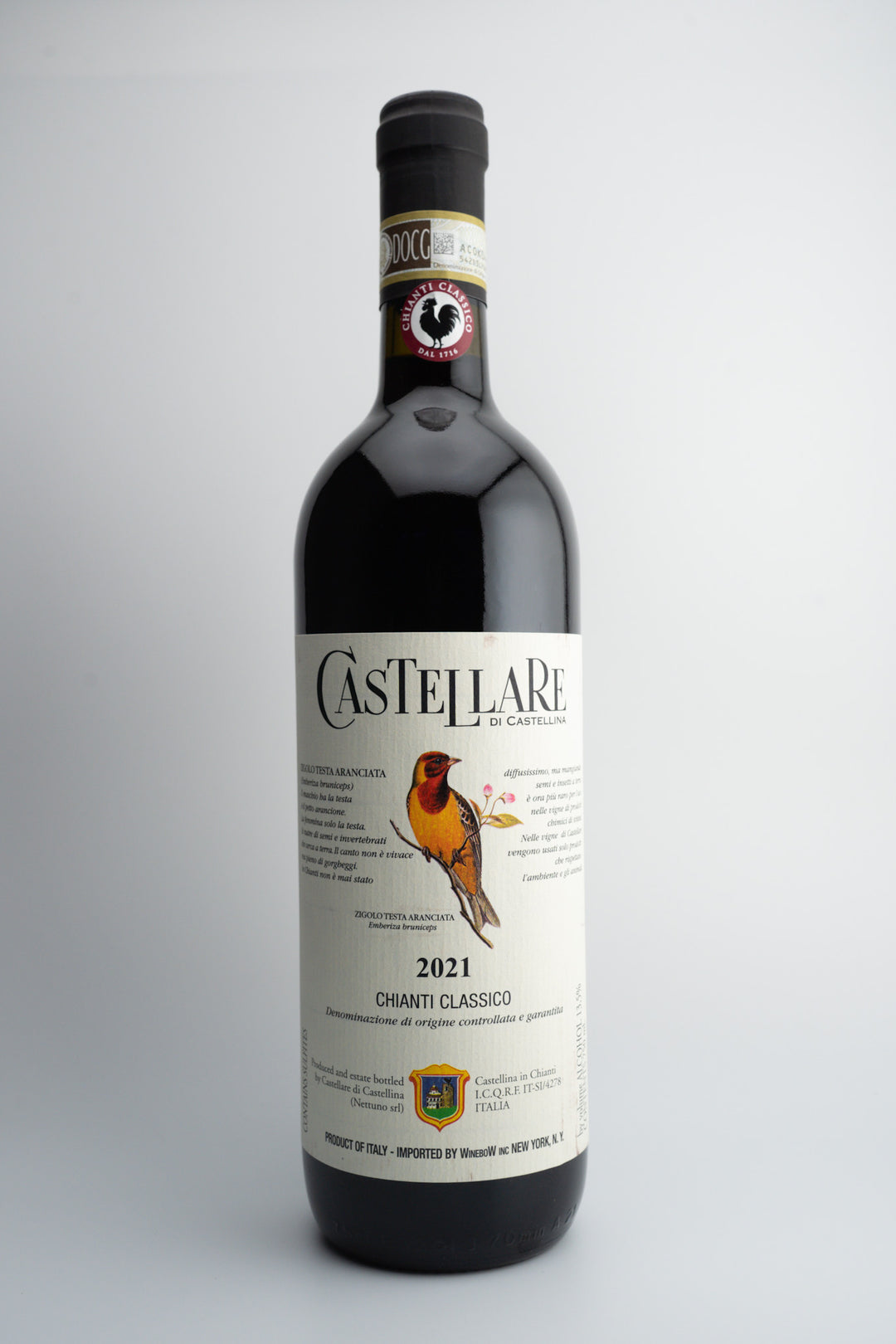 A bottle of 2021 Castellare Chianti Classico red wine with a label featuring a bird and vineyards.