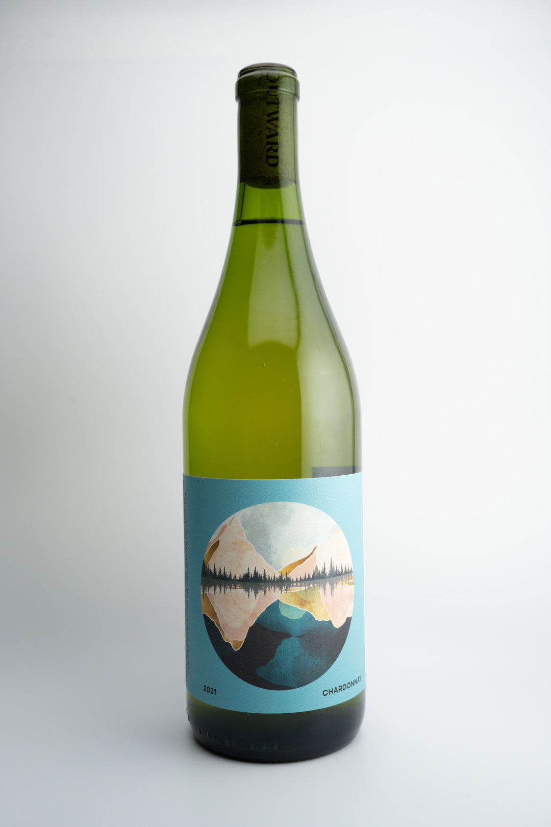A bottle of 2021 Outward Wines Bassi Vineyard Chardonnay with a label showcasing a stylized landscape.
