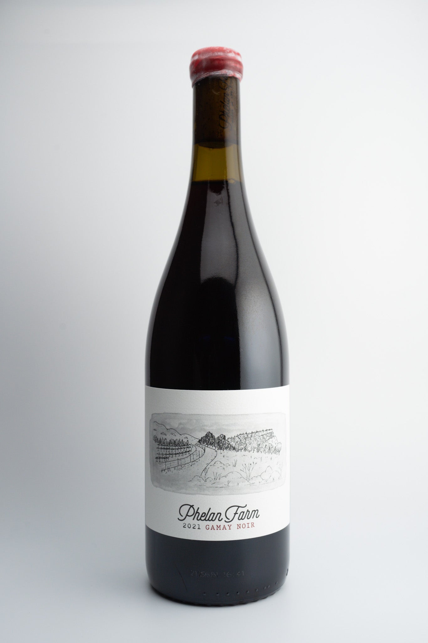A bottle of 2021 Phelan Farms Gamay Noir wine with a label that includes the brand name and the word 'Gamay'.