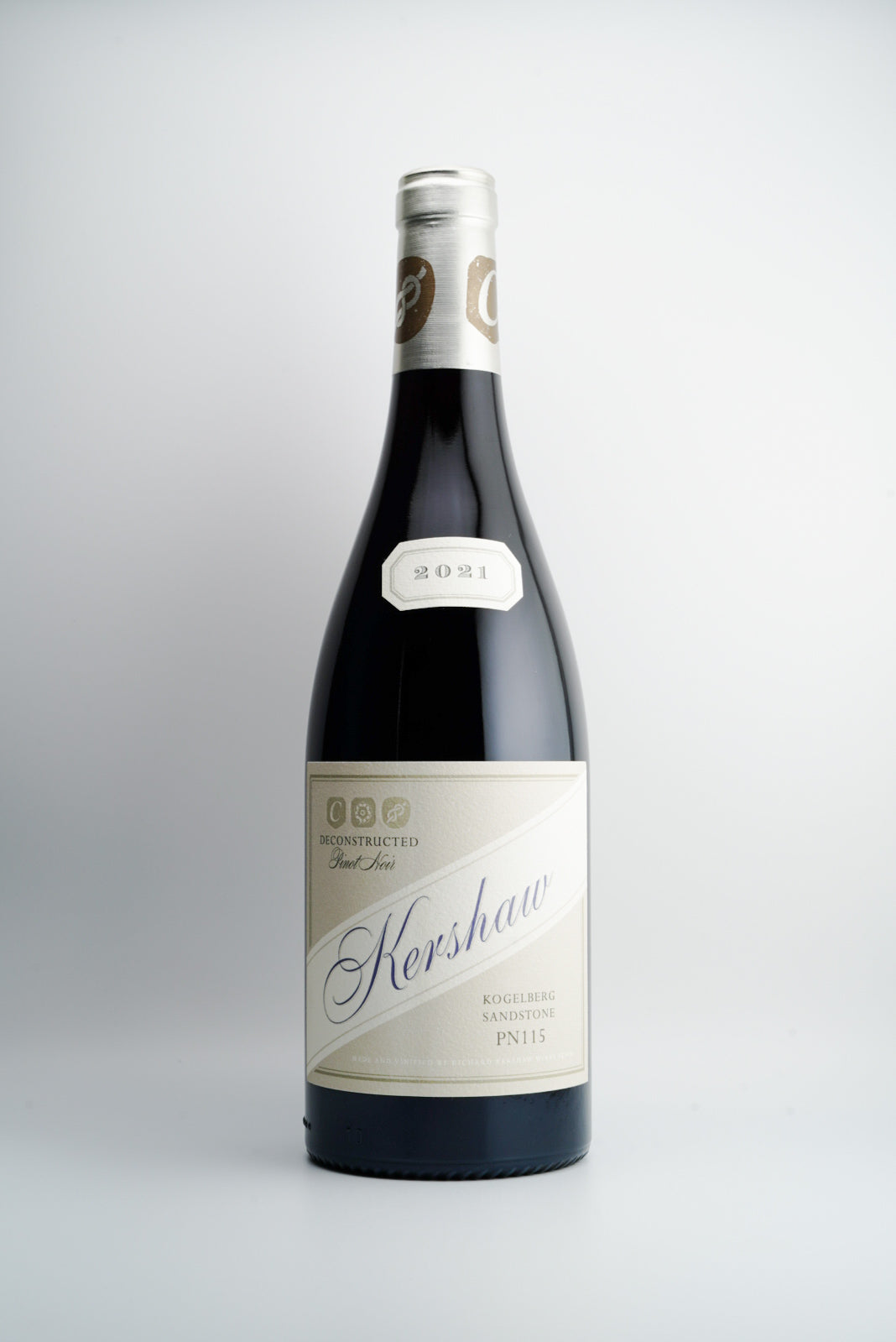 A bottle of Richard Kershaw 'Deconstructed PN115' Pinot Noir wine with a label that includes the brand name and the year 2021.