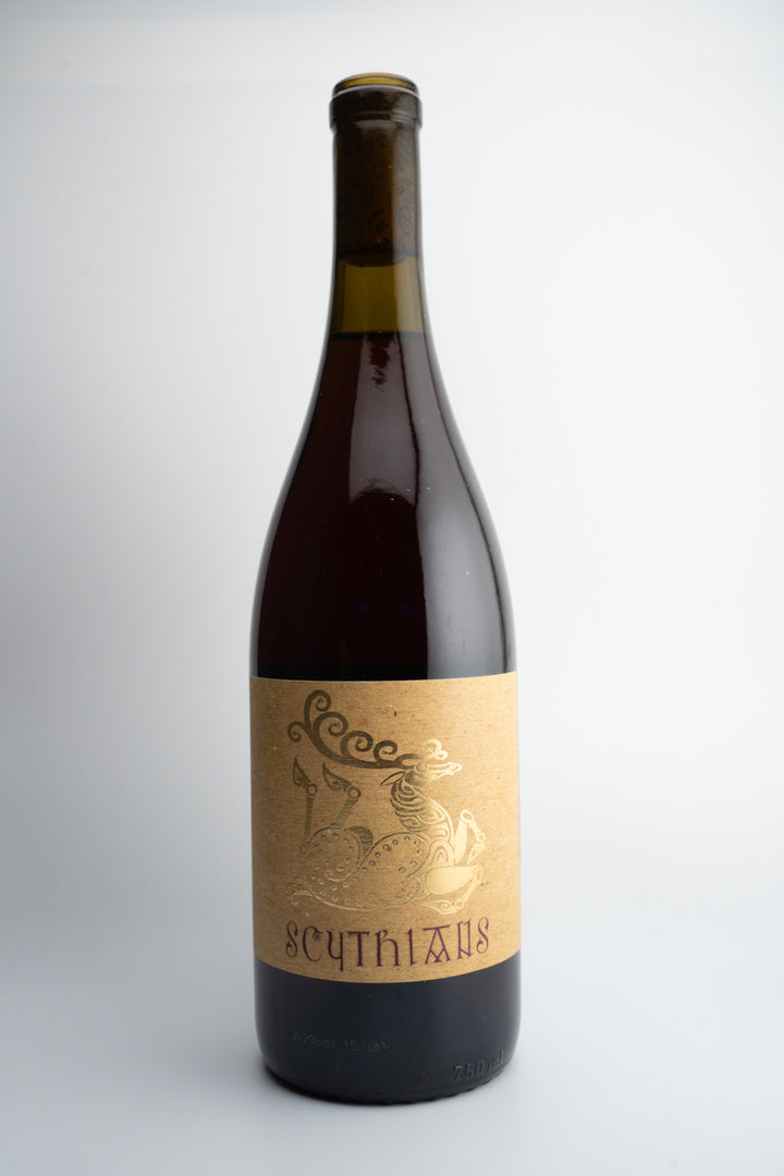 A bottle of 2021 Scythians Red Blend wine with a label that has an engraving of a person and text, indicating it is from Cucamonga Valley, California.