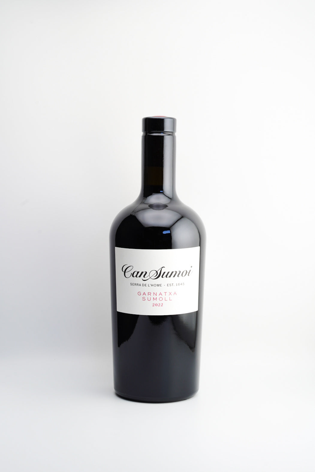 A bottle of Can Sumoi Garnatxa-Sumoll wine from Penedès, Spain, with a white label on a black bottle.