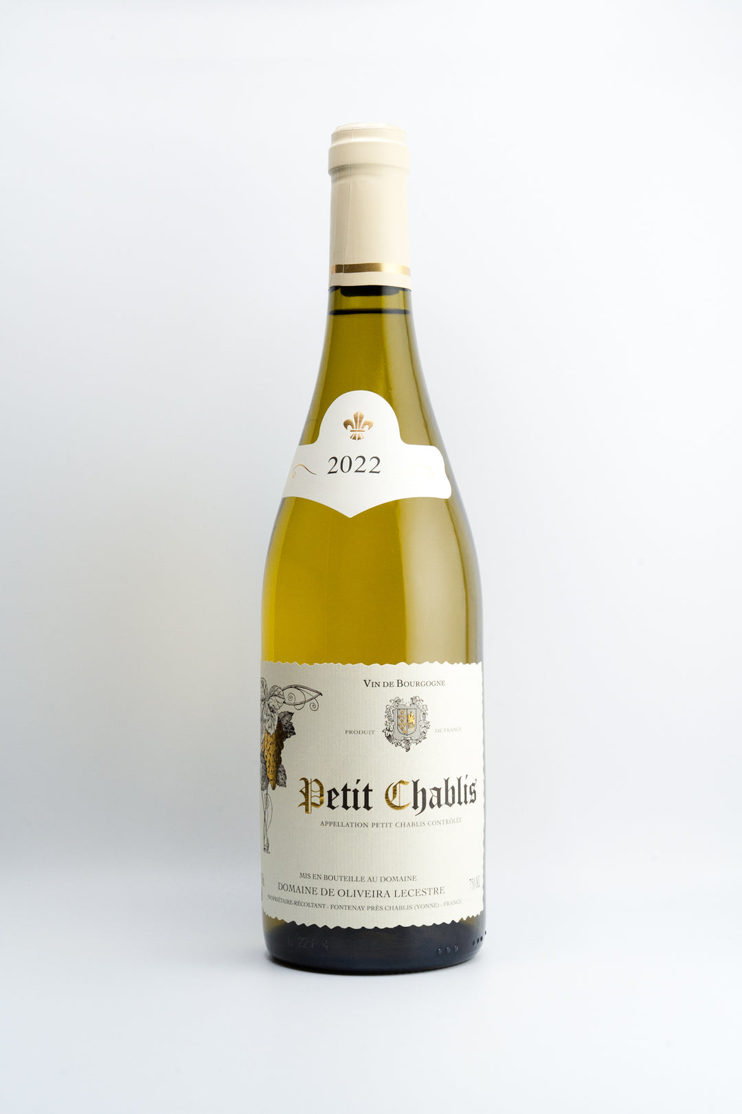 A bottle of 2022 Domaine De Oliveira Lecestre Petit Chablis, Burgundy, France with a white label and yellowish-gold tinted glass.