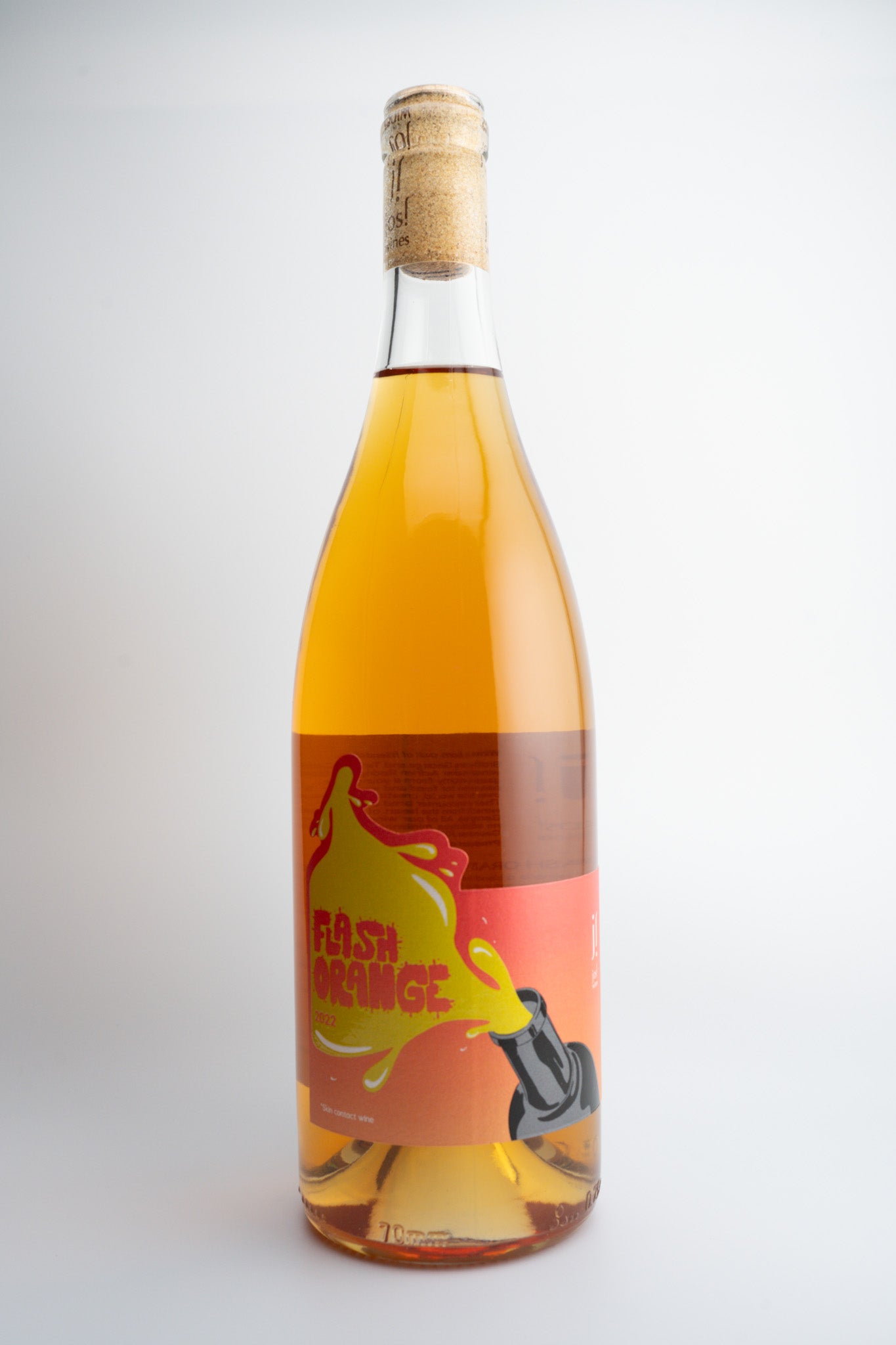 A bottle of 2022 Jos! Wines 'Flash' Orange Wine with a label featuring a peach and text, against a plain background.