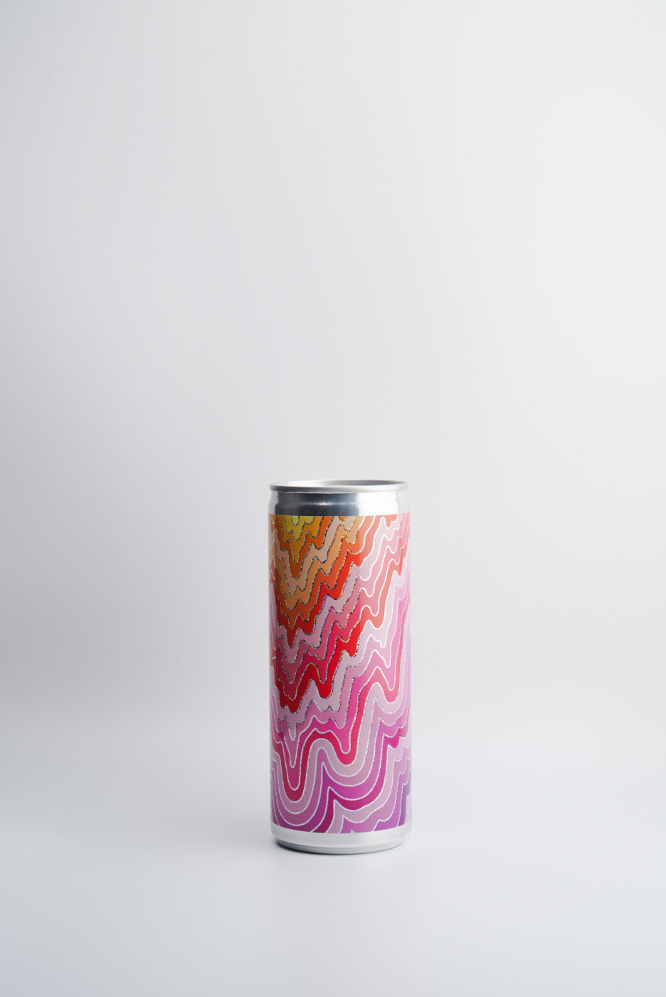 A can of 2022 Las Jaras WAVES Rosé wine with a multicolored abstract pattern.