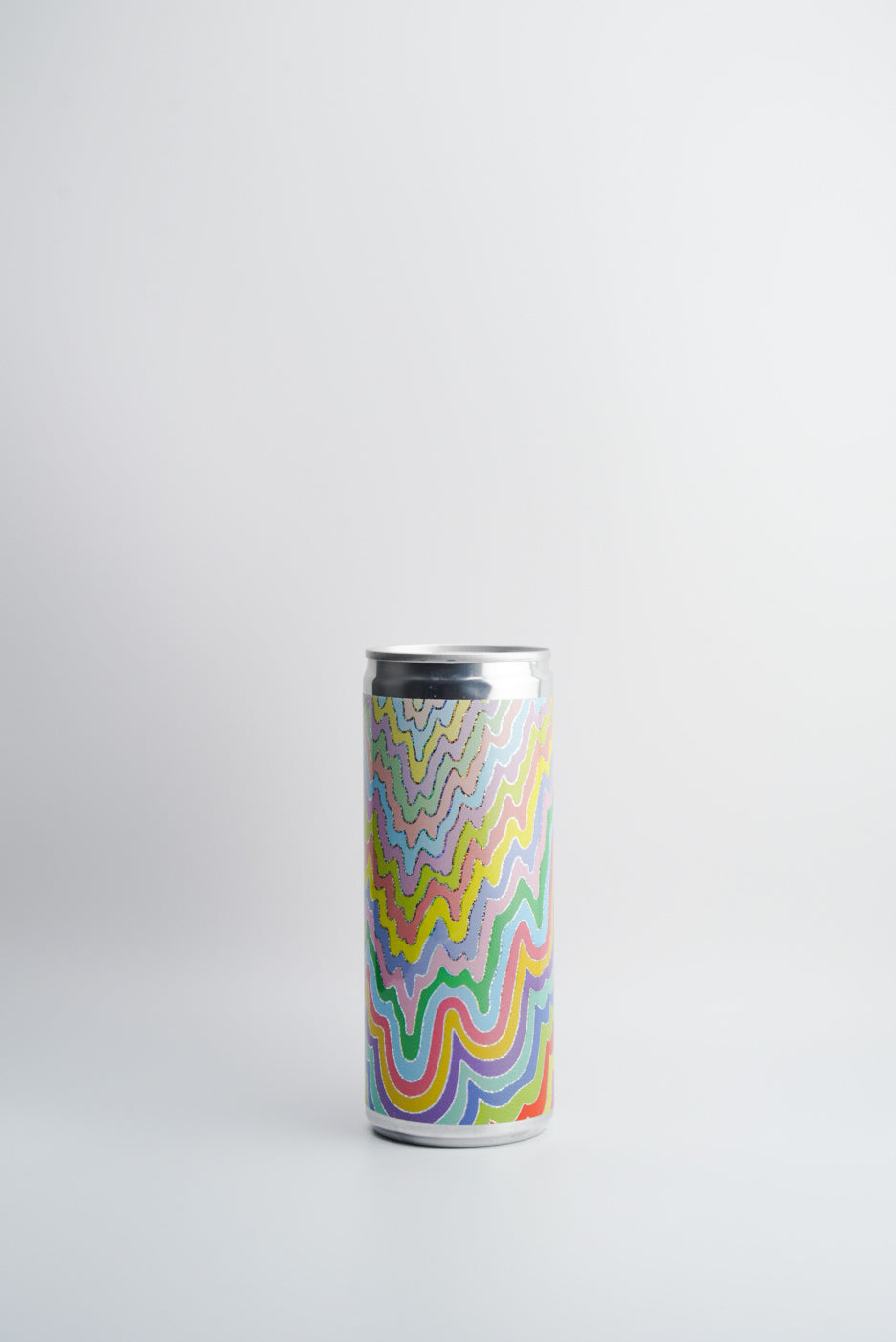 A can of 2022 Las Jaras WAVES Sparkling White Wine, California. The can is decorated with a multicolored geometric pattern.