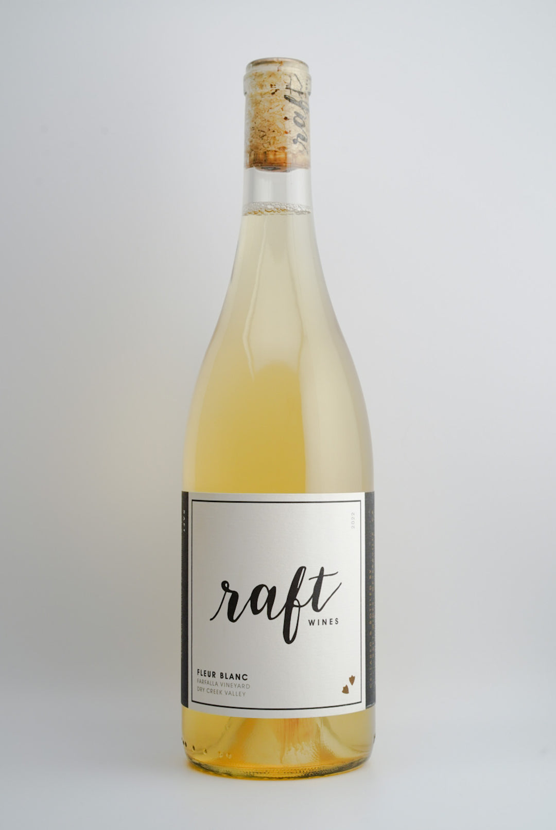 A bottle of 2022 Raft 'Fleur Blanc' white wine from Dry Creek Valley, Sonoma, California with a simple label design.