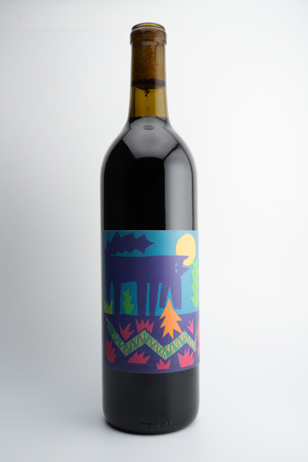 A bottle of 2022 Vinos Pijoan 'El Carbónico' wine with a colorful label featuring a vibrant sunset and pine trees in the background, indicative of the wine's natural and organic qualities.