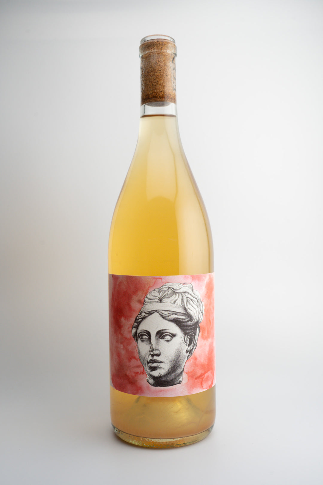 A bottle of 2023 End of Nowhere 'Little Faith' Skin Contact wine with a label depicting a classical sculpture or bust, set against a neutral background.