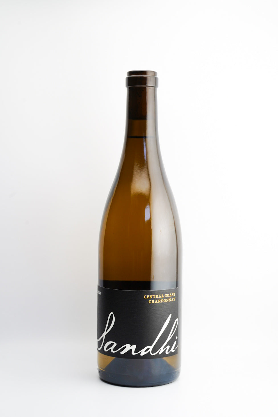 A bottle of Sandhi Chardonnay wine with a white label on a clear background.