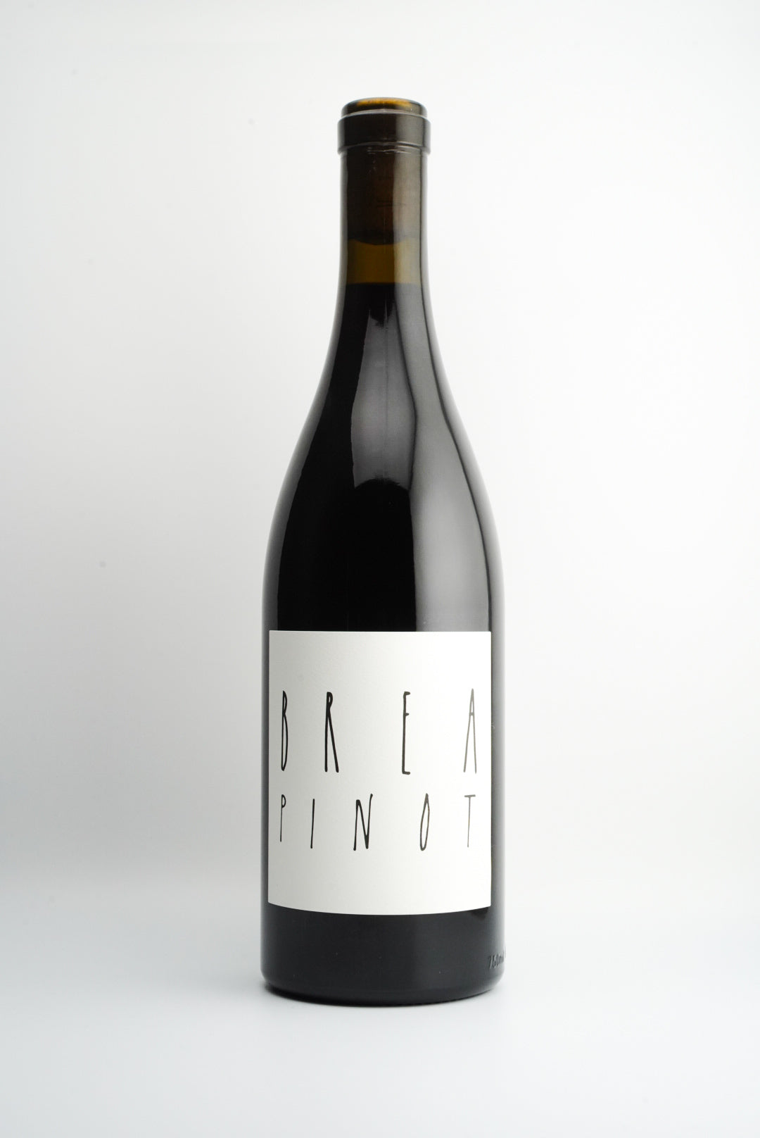 A bottle of BREA Wine Co. Pinot Noir with a label that includes the wine variety and 'Massa Vineyard, Central Coast, California'.