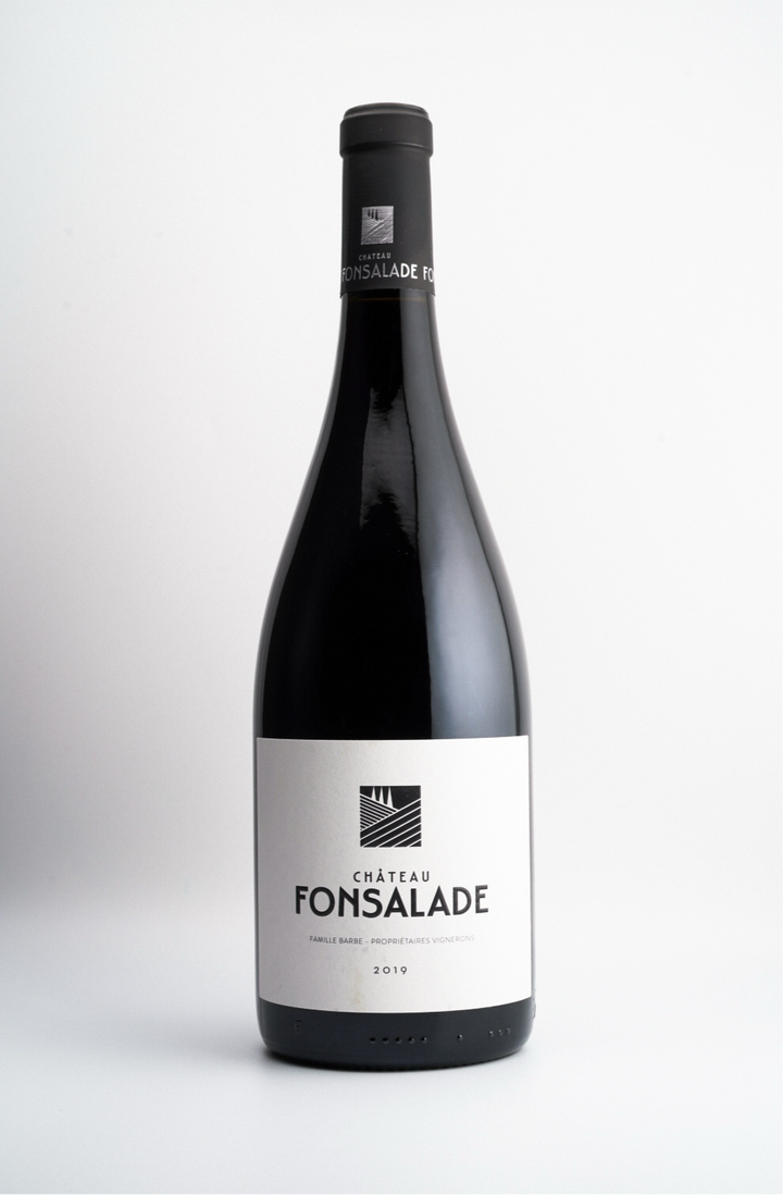 A bottle of 2019 Cháteau Fonsalade Grand Cuvée wine with a dark label and a visible brand name, placed against a white background.