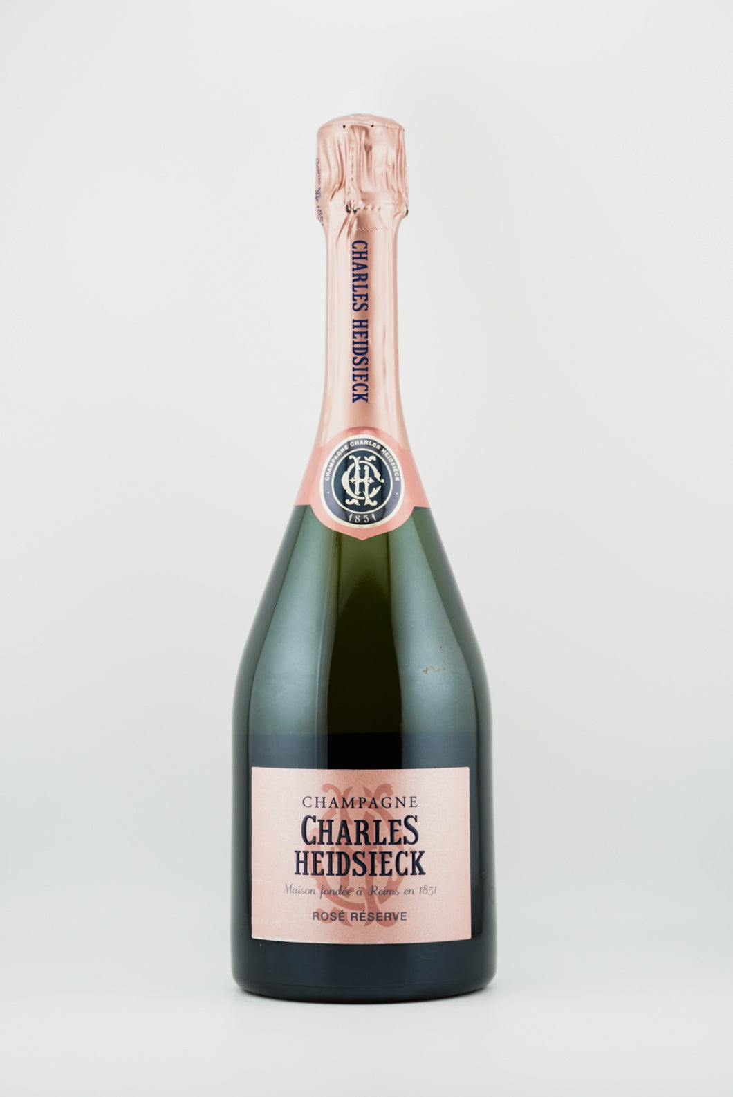 Bottle of Charles Heidsieck rose champagne on a white background