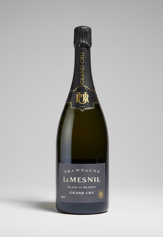 Bottle of RWC Le Mesnil Grand Cru Blanc de Blancs champagne on a gray background