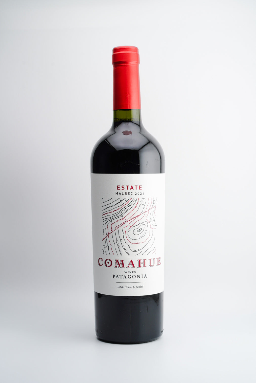 A bottle of 2021 Comahue Estate Malbec wine from Patagonia, Argentina, with a red cap and a label featuring the name 'Comahue' and the region 'Patagonia, Argentina'.
