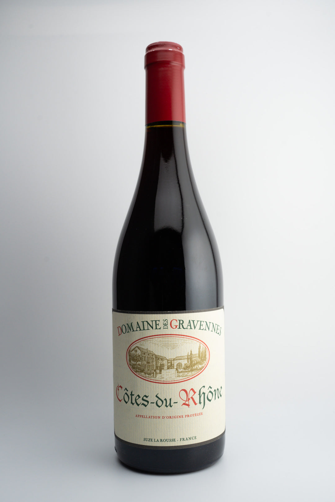 A bottle of Domaine des Gravennes Côtes du Rhône wine with a red cap, labeled with the brand and product name, against a white background.