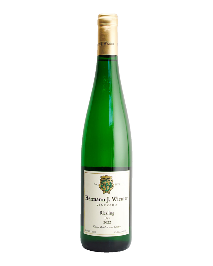 A bottle of Hermann J. Wiemer Dry Riesling wine with a label indicating it is from Seneca Lake AVA, Finger Lakes, New York.