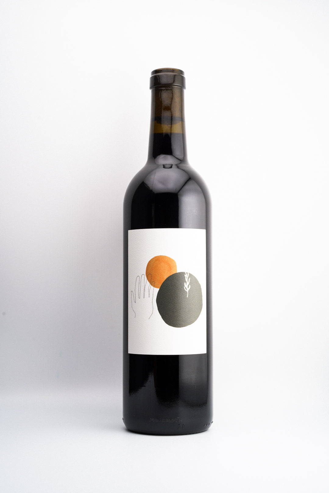 A bottle of LÜUMA Cabernet Sauvignon wine with a label featuring a graphic of a sun and a grape, indicative of the wine's organic farming and Calistoga AVA, Napa Valley, California origin.