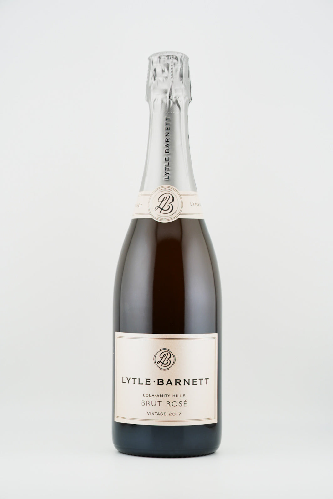 Bottle of Lyttle-Barnett Brut Rosé sparkling wine on a white background