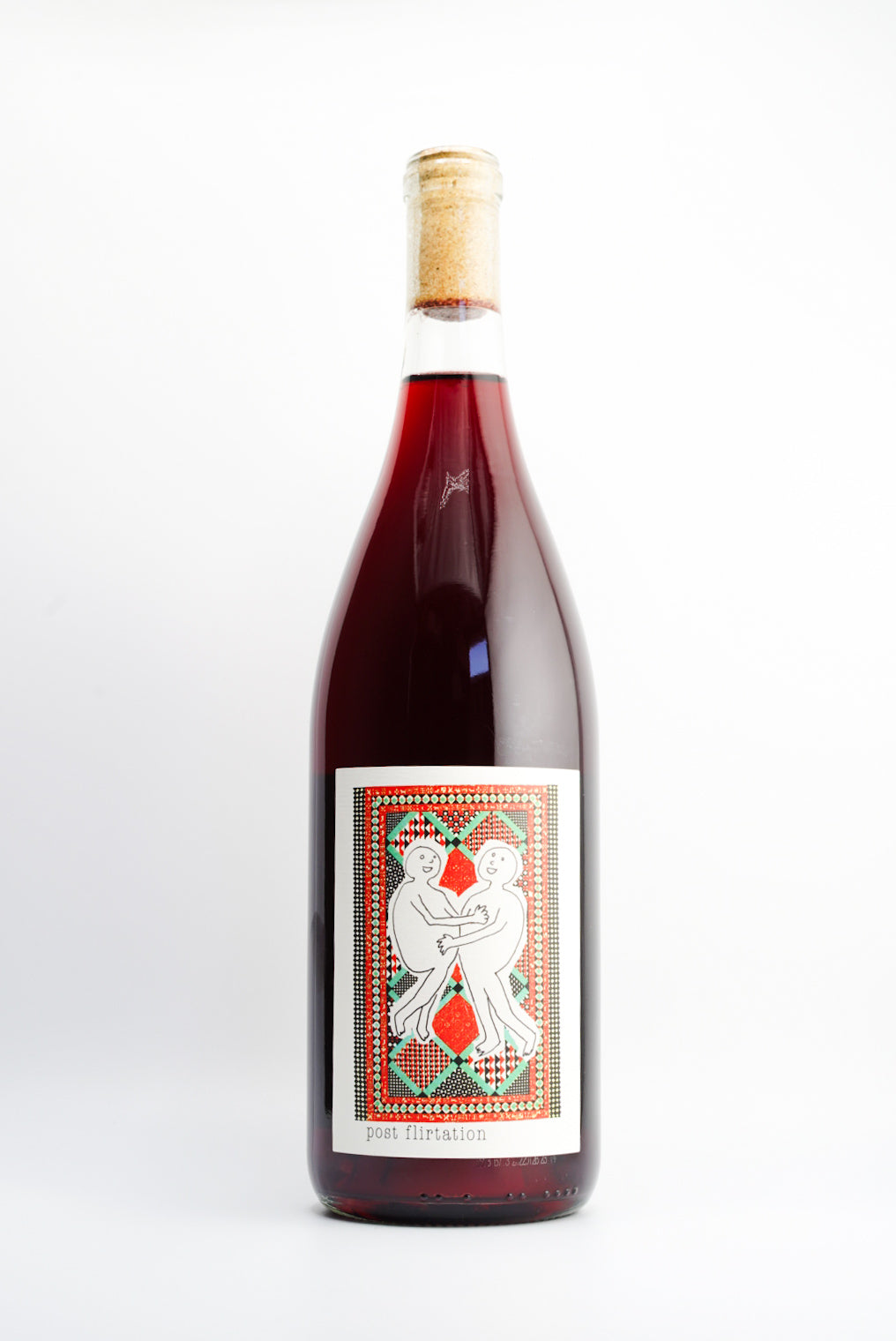 A bottle of Martha Stoumen Post Flirtation Red wine with a label depicting a stylized illustration of a face with flowers and a bird.