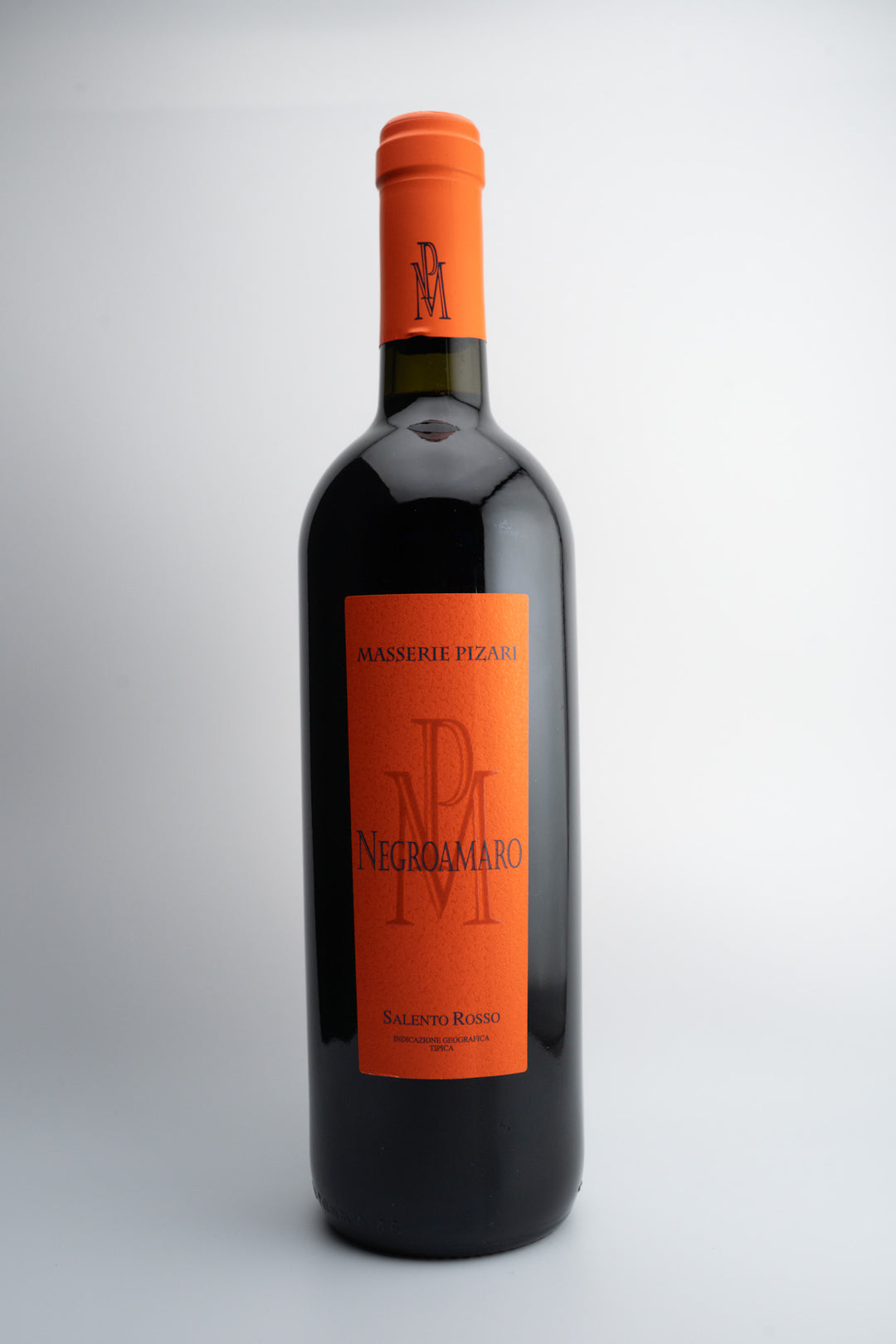 A bottle of Masserie Pizari Negroamaro wine with an orange label, indicating the grape variety and Italian origin.