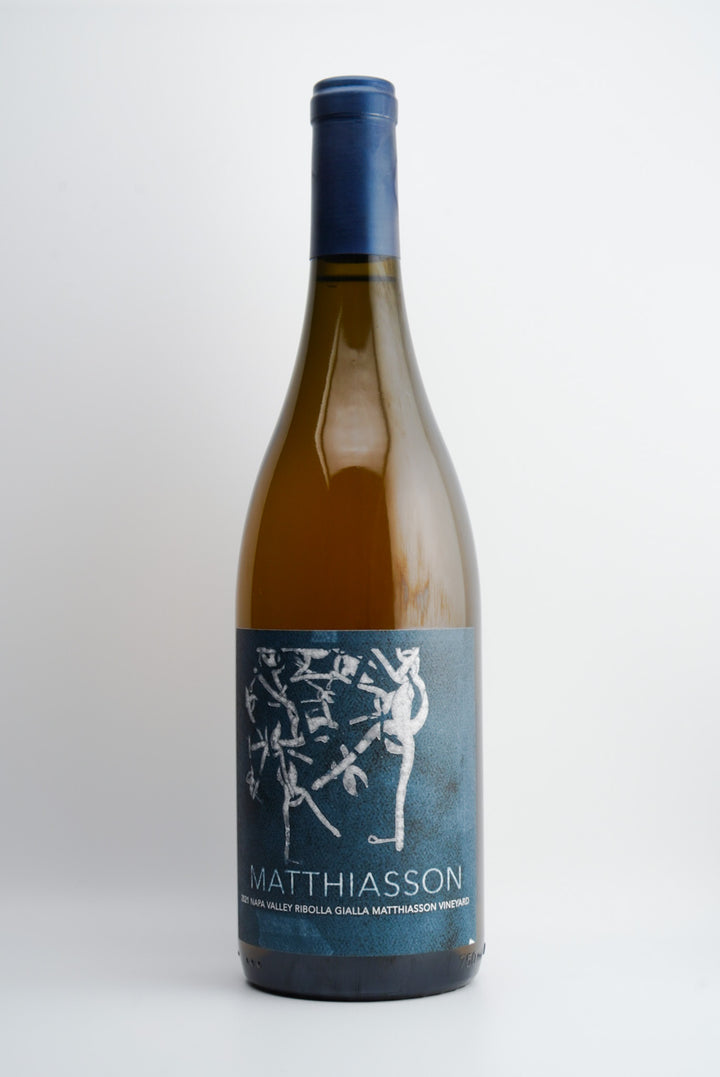 A bottle of Matthiasson Estate Ribolla Gialla wine from Napa Valley, California, with a label depicting a blue and white illustration.