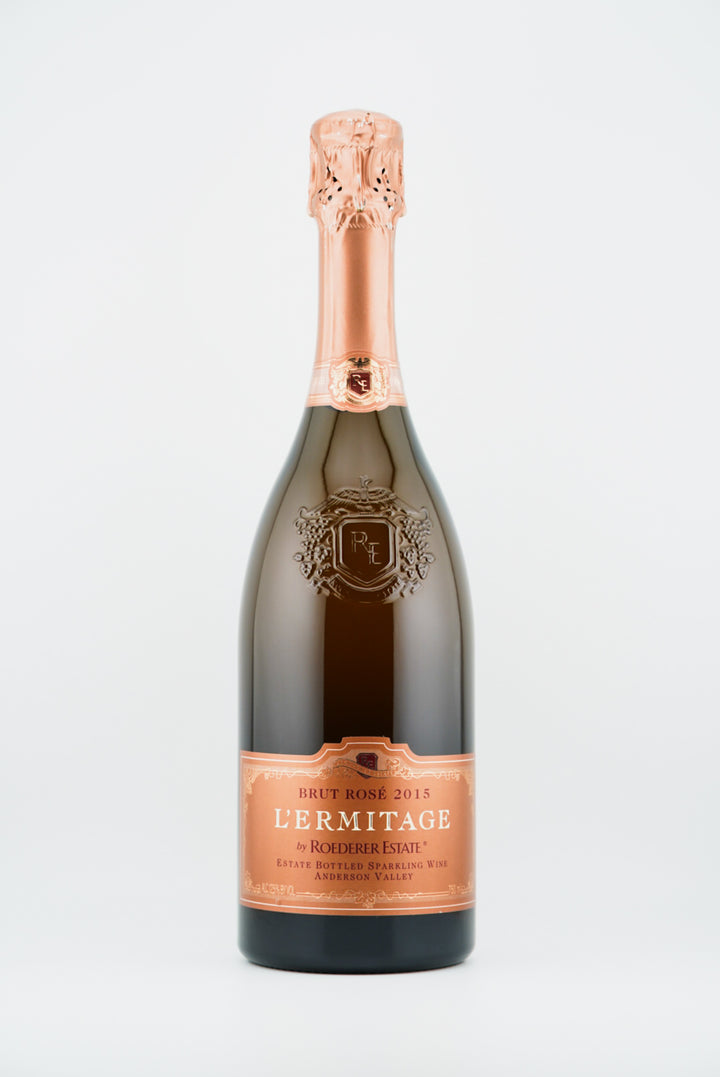 Bottle of Lémitage sparkling wine on a light gray background