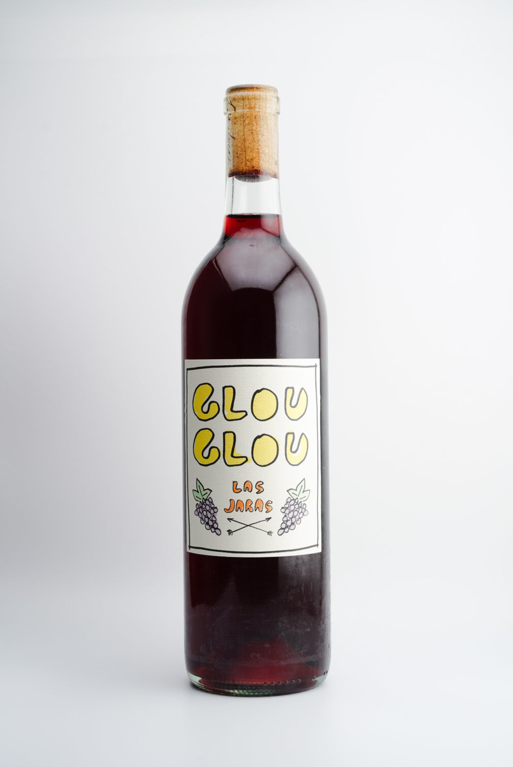 A bottle of 2022 Las Jaras 'Glou Glou' red wine with a label that includes the brand name and the words 'LOS GLOU' in a bold, simple font, capped with a cork.