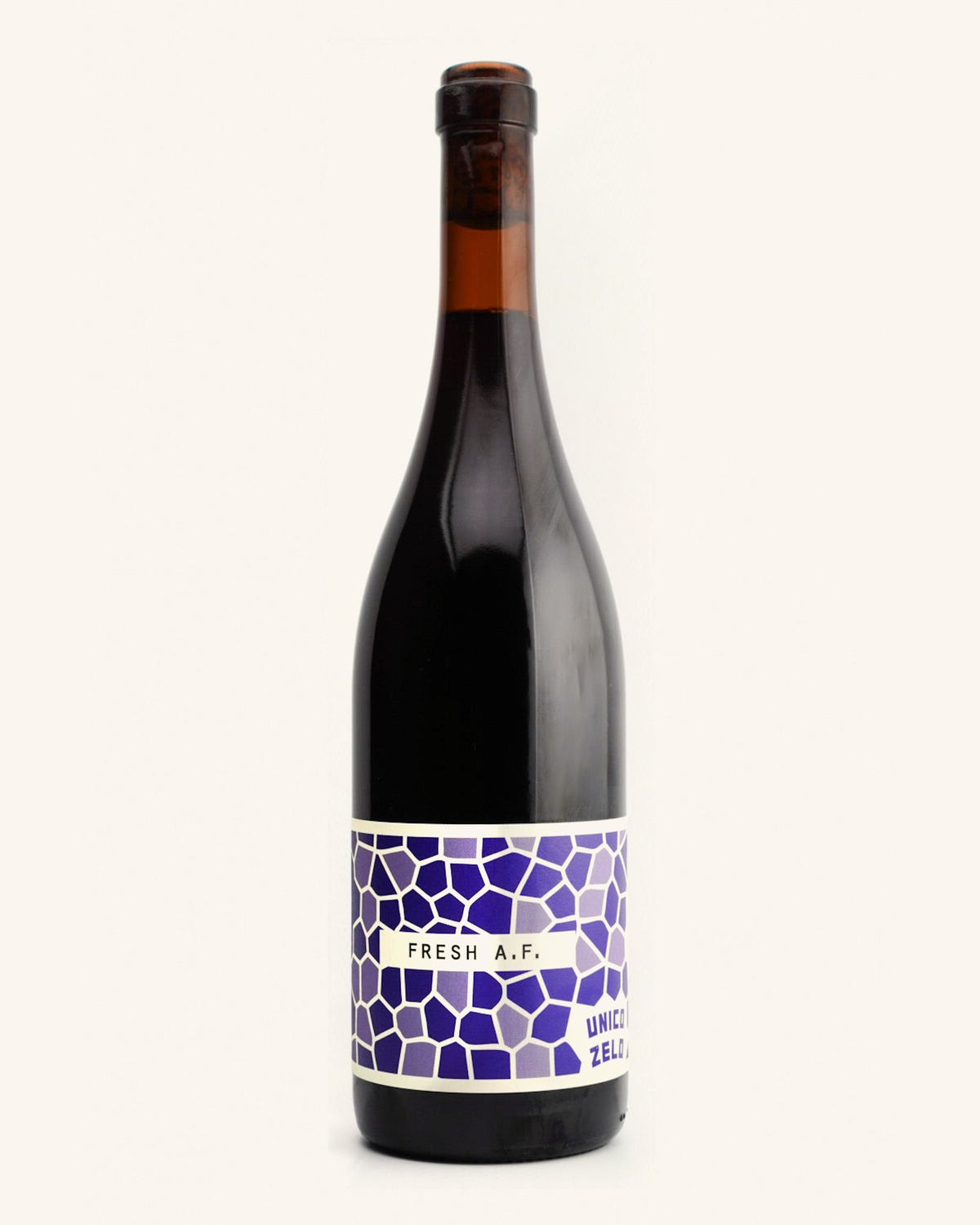 A bottle of Unico Zelo Fresh A.F. Nero d'Avola wine with a purple label.